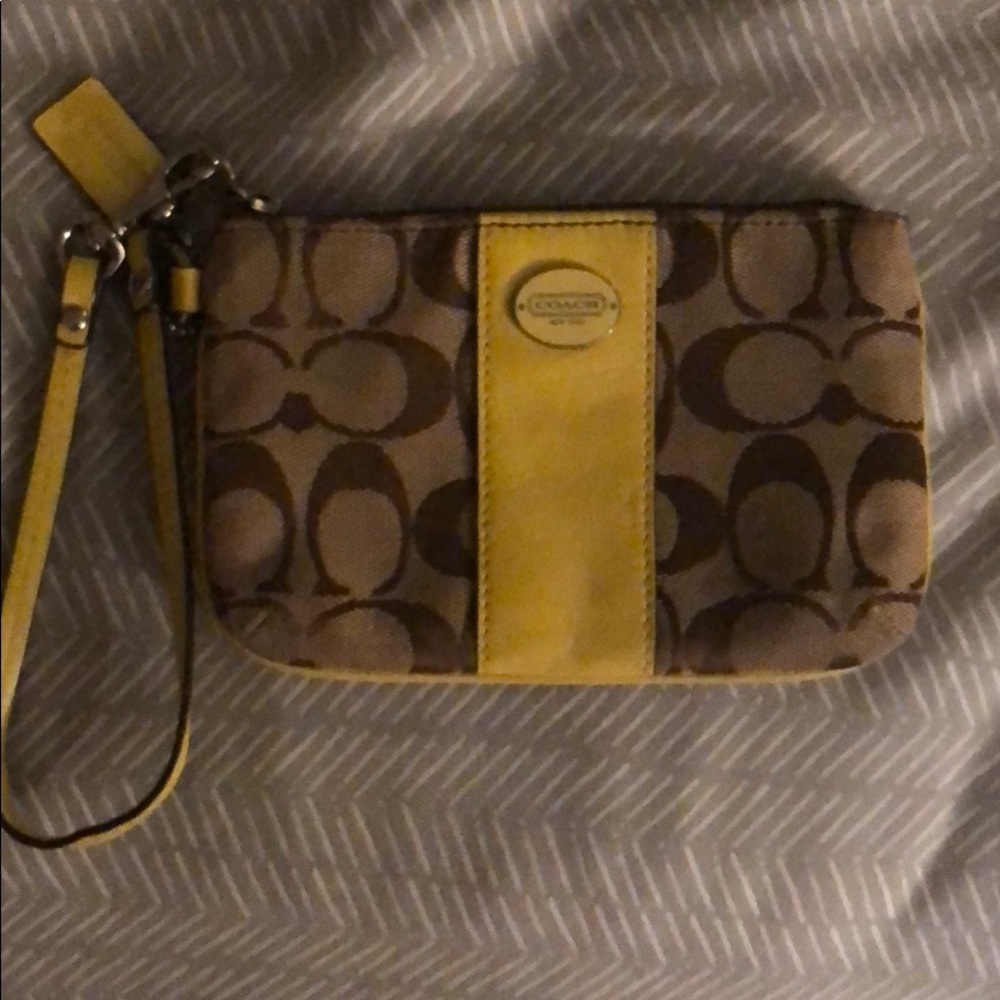 Yellow and brown coach wristlet